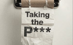 The front cover of the report: Taking the P***: the decline of the great British public toilet showing a toilet roll on a metal holder with the title of the report overlayed in black.