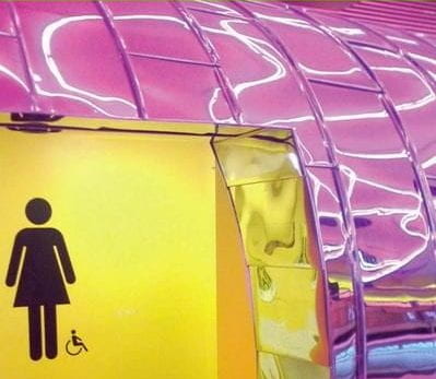 Front cover of Publicly Accessible Toilets: An Inclusive Design Guide showing a colourful entrance to a toilet in yellow and pink.
