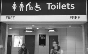 High level Toilet Sign in British Rail Station, toilets marked FREE (no payment)
